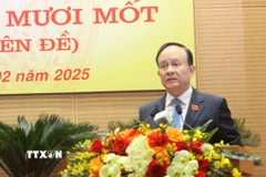 Chủ tịch Hội đồng Nhân dân thành phố Hà Nội Nguyễn Ngọc Tuấn phát biểu tại kỳ họp. (Ảnh: Nguyễn Thắng/TTXVN)