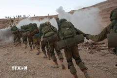Lực lượng Phòng vệ Israel (IDF) được điều động tham gia chiến dịch quân sự ở Dải Gaza, tập trung tại Masada (Israel). ̣̣(Ảnh: THX/TTXVN)