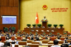 Quốc hội biểu quyết thông qua Luật Xây dựng (sửa đổi). (Ảnh: Doãn Tấn/TTXVN)