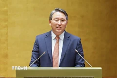 Bộ trưởng Bộ Tư pháp Nguyễn Hải Ninh giải trình, làm rõ một số vấn đề đại biểu Quốc hội nêu. (Ảnh: Doãn Tấn/TTXVN)