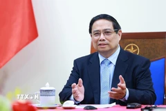 Thủ tướng Phạm Minh Chính điện đàm với Thủ tướng Malaysia Anwar Ibrahim. (Ảnh: Dương Giang/TTXVN)