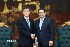 Thủ tướng Phạm Minh Chính tiếp ông Bùi Kim Giai, Bộ trưởng Bộ Công tác Quân nhân xuất ngũ Trung Quốc. (Ảnh: Dương Giang/TTXVN)
