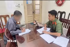 Ông N.N.T làm việc tại cơ quan Công an. (Ảnh: TTXVN phát)