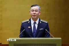 Tổng Kiểm toán Nhà nước Ngô Văn Tuấn trình bày Báo cáo công tác nhiệm kỳ 2021-2026 của Kiểm toán Nhà nước. (Ảnh: Phạm Kiên/TTXVN)