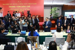 Thủ tướng Phạm Minh Chính thăm Trung tâm báo chí Đại hội Đảng toàn quốc lần thứ XIV. (Ảnh: TTXVN)