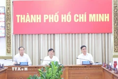 Ông Võ Văn Minh, Chủ tịch Hội đồng Nhân dân Thành phố Hồ Chí Minh, Chủ tịch Ủy ban Bầu cử Thành phố, chủ trì Hội nghị. (Ảnh: Hữu Duyên/TTXVN)