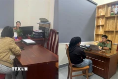 Hai cá nhân lan truyền thông tin sai sự thật trên mạng xã hội về vụ việc trên làm việc tại cơ quan Công an. (Ảnh: TTXVN phát)