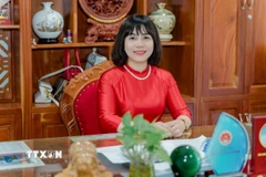 Bà Nguyễn Thị Bích Ly, Phó trưởng Ban Tuyên giáo và Dân vận tỉnh Gia Lai, chia sẻ luôn tin tưởng vào những văn kiện, quyết sách của Đại hội sẽ giúp cho Việt Nam ngày càng phát triển. (Ảnh: Sỹ Thắng/TTXVN)