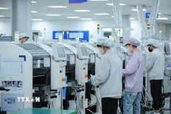 Nhiều hệ thống máy móc hiện đại, tiên tiến nhất đã được các doanh nghiệp FDI đầu tư sản xuất. (Ảnh: Hoàng Hiếu/TTXVN)