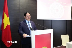 Thủ tướng Phạm Minh Chính phát biểu tại buổi gặp cán bộ, nhân viên Đại sứ quán và cộng đồng người Việt Nam tại Estonia. (Ảnh: Dương Giang/TTXVN)