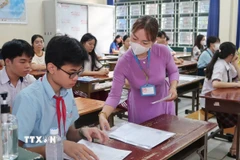 Thí sinh tại điểm thi Trường THPT Nguyễn Hữu Huân, Thành phố Hồ Chí Minh. (Ảnh: Thu Hoài/TTXVN)