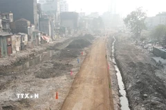 Sau khi tuyến đường được thông xe kỹ thuật, người dân đi lại thuận tiện hơn. (Ảnh: Nguyễn Thắng/TTXVN)