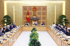Thủ tướng Phạm Minh Chính gặp mặt đại diện các doanh nghiệp Hoa Kỳ đang đầu tư, kinh doanh tại Việt Nam. (Ảnh: Dương Giang/TTXVN)