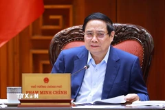 Thủ tướng Phạm Minh Chính chủ trì họp Thường trực Chính phủ về phát triển Đề án Khu thương mại tự do và Trung tâm lọc hóa dầu và năng lượng quốc gia tại Dung Quất. (Ảnh: Dương Giang/TTXVN)