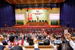 Đại hội biểu quyết thông qua danh sách bầu cử Ban Chấp hành Trung ương Đảng khóa XIV. (Ảnh: TTXVN)