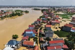 Mưa lũ sau bão số 11 gây thiệt hại trên 8.720 tỷ đồng, còn hơn 12.230 nhà bị ngập. (Ảnh: Hoàng Hiếu/TTXVN)