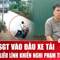 Tạm giữ hình sự đối tượng đẩy Cảnh sát giao thông vào đầu xe tải. (Nguồn: Vietnam+)