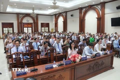 Các đại biểu biểu quyết tại Kỳ họp. (Ảnh: Đức Tâm/TTXVN)