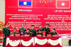 Các đơn vị ký kết quy chế phối hợp hoạt động. (Ảnh: TTXVN phát)