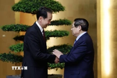 Thủ tướng Phạm Minh Chính tiếp Đại sứ Trung Quốc tại Việt Nam Hà Vĩ. (Ảnh: Dương Giang/TTXVN)