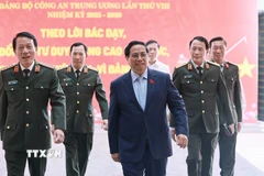 Thủ tướng Phạm Minh Chính đến dự Hội nghị Sơ kết 01 năm triển khai lực lượng tham gia bảo vệ an ninh, trật tự ở cơ sở. (Ảnh: Dương GiangTTXVN)