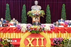 Tổng Bí thư Đảng Nhân dân Cách mạng Lào Thongloun Sisoulith phát biểu khai mạc Đại hội đại biểu toàn quốc lần thứ XII của Đảng Nhân dân Cách mạng Lào. (Ảnh: TTXVN phát)