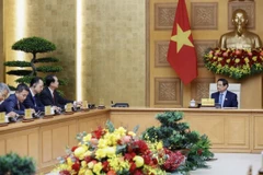 Thủ tướng Phạm Minh Chính tiếp Đại sứ Trung Quốc tại Việt Nam Hà Vĩ. (Ảnh: Dương Giang/TTXVN)