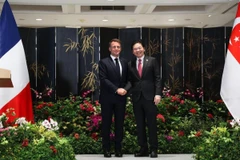 Thủ tướng Singapore Lawrence Wong và Tổng thống Pháp Emmanuel Macron. (Ảnh: straitstimes)