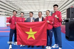 Niềm vui của đội tuyển Karate Việt Nam. (Ảnh: TTXVN phát)