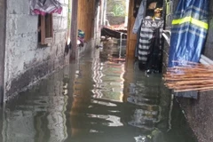 Mực nước lũ dâng cao đến một mét tại các khu dân cư ở Denpasar. (Ảnh: jakartaglobe)