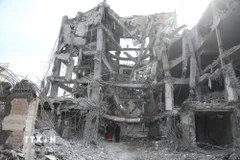 Những tòa nhà bị phá hủy sau các cuộc tấn công của Mỹ và Israel nhằm vào Tehran, Iran. (Ảnh: THX/TTXVN)