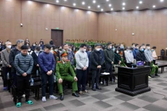 Các bị cáo tại phiên tòa xét xử. (Ảnh: Phạm Kiên/TTXVN)