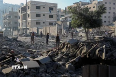 Tòa nhà bị phá hủy trong xung đột tại phía Tây thành phố Gaza. (Ảnh: THX/TTXVN)