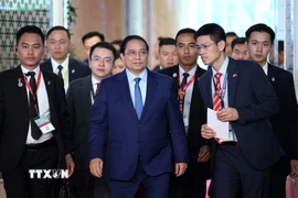 Thủ tướng Phạm Minh Chính đến dự phiên thảo luận. (Ảnh: Dương Giang/TTXVN)