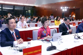 Các đại biểu tham dự buổi họp báo. (Ảnh: Phạm Kiên/TTXVN)