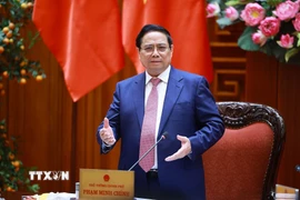 Thủ tướng Phạm Minh Chính chủ trì họp Thường trực Chính phủ về bình ổn giá xăng dầu. (Ảnh: Dương Giang/TTXVN)