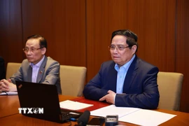 Thủ tướng Phạm Minh Chính họp trực tuyến đến các tỉnh, thành phố trong nước để triển khai các phương án cứu hộ, cứu nạn và khắc phục hậu quả thiên tai. (Ảnh: Dương Giang/TTXVN)