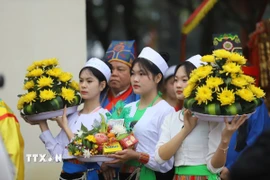 Vẻ đẹp của thiếu nữ dân tộc Mường tại Lễ hội. (Ảnh: Trọng Đạt/TTXVN)