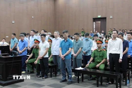 Các bị cáo tại phiên toà xét xử sáng 10/9. (Ảnh: Phạm Kiên/TTXVN)
