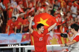 Các cầu thủ U22 Việt Nam hân hoan trong niềm vui chiến thắng. (Ảnh: Minh Quyết/TTXVN)