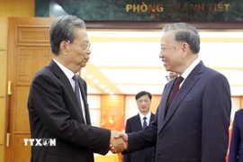 Tổng Bí thư Tô Lâm tiếp Ủy viên trưởng Nhân đại toàn quốc Trung Quốc Triệu Lạc Tế. (Ảnh: Thống Nhất/TTXVN)