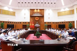 Thủ tướng Phạm Minh Chính chủ trì cuộc họp Thường trực Chính phủ với các địa phương để tháo gỡ khó khăn, vướng mắc cho các dự án tồn đọng. (Ảnh: Dương Giang/TTXVN)