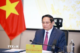 Thủ tướng Phạm Minh Chính chủ trì phiên họp thứ 23 của Ban Chỉ đạo quốc gia về phòng, chống khai thác hải sản bất hợp pháp, không báo cáo, không theo quy định (IUU) từ điểm cầu Thành phố Hồ Chí Minh. (Ảnh: Dương Giang/TTXVN)