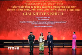 Tác giả Đỗ Minh Thu - Báo điện tử VietnamPlus (TTXVN) đoạt giải Khuyến khích. (Ảnh: Phạm Tuấn Anh/TTXVN)