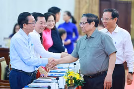 Thủ tướng Phạm Minh Chính với các đại biểu. (Ảnh: Dương Giang/TTXVN)