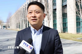 Giáo sư Khúc Cường, chuyên gia bình luận của CGTN, giảng viên Đại học Dân tộc Trung ương Trung Quốc. (Ảnh: Quang Hưng/TTXVN)