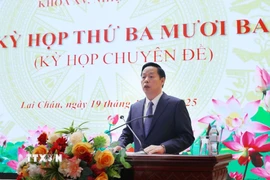 Tân Chủ tịch UBND tỉnh Lai Châu, đồng chí Hà Quang Trung phát biểu nhận nhiệm vụ. *Ảnh: Quý Trung/TTXVN)