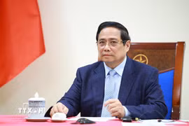 Thủ tướng Phạm Minh Chính điện đàm với Thủ tướng Kuwait Sheikh Ahmad Abdullah Al-Ahmad Al Sabah. (Ảnh: Dương Giang/TTXVN)