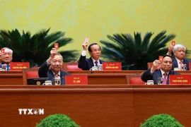 Đại hội biểu quyết thông qua dự thảo điều chỉnh chương trình Đại hội. (Ảnh: TTXVN)