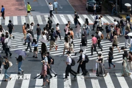 Người dân tại Tokyo, Nhật Bản. (Ảnh: AFP/TTXVN)